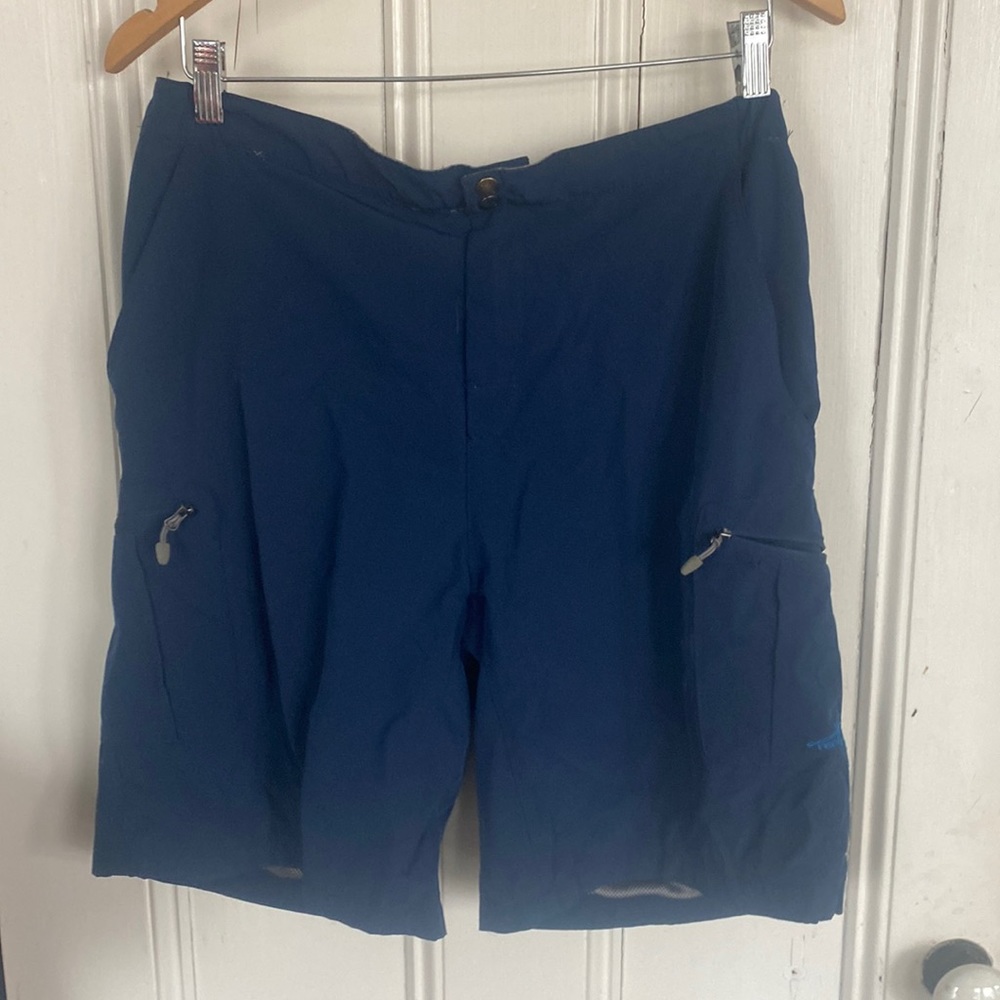 Reel Life shorts or maybe swim trunks.  Mesh pockets with zippers mens large.